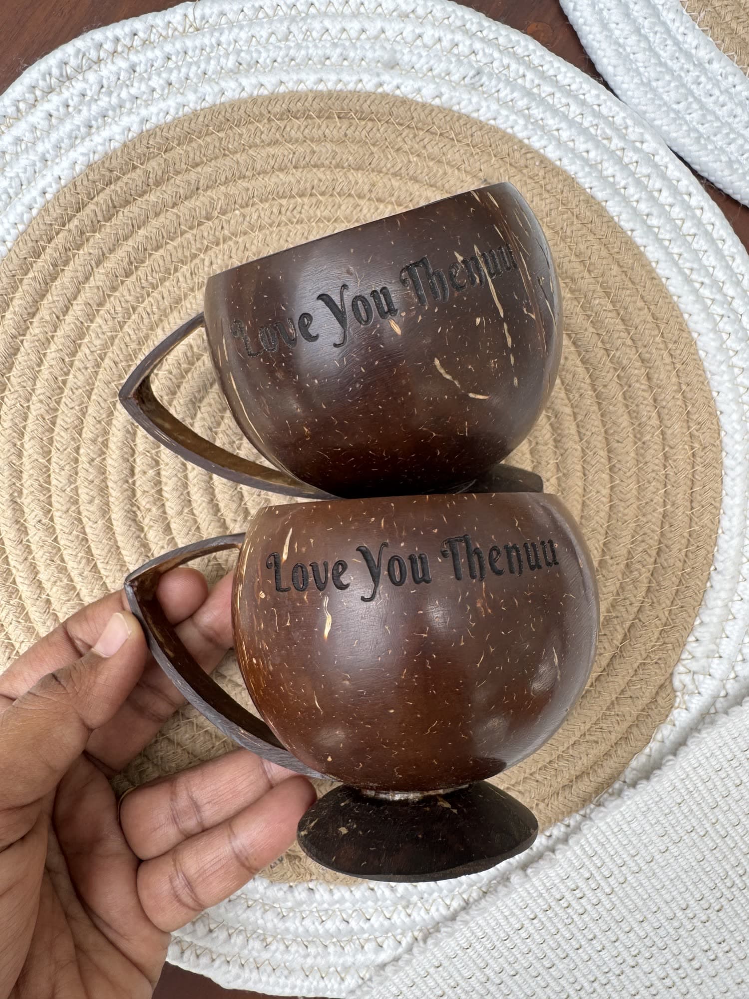 Coconut shell teacups laser-engraved with a message