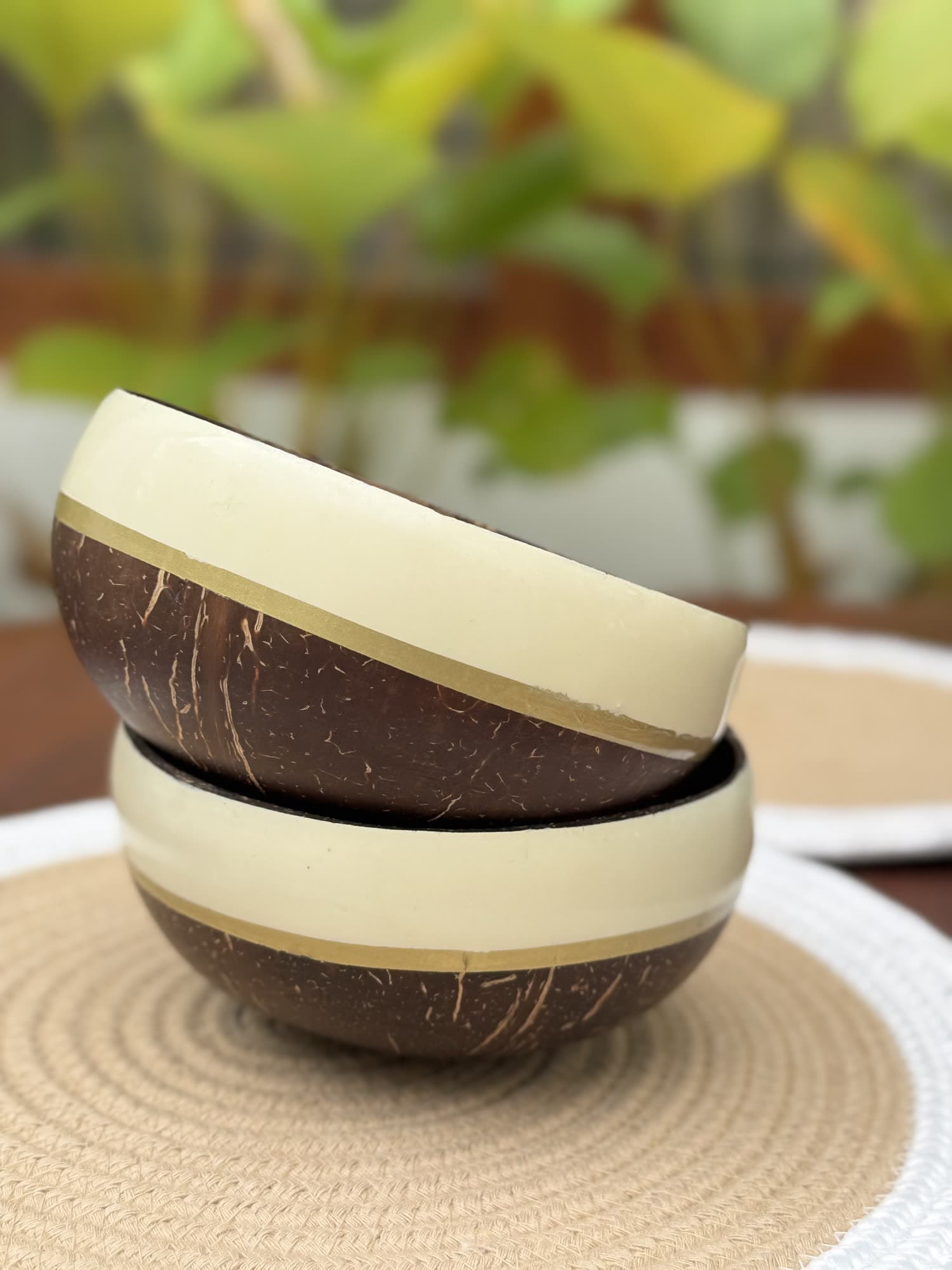 Coconut shell bowls with a painted cream rim and gold band